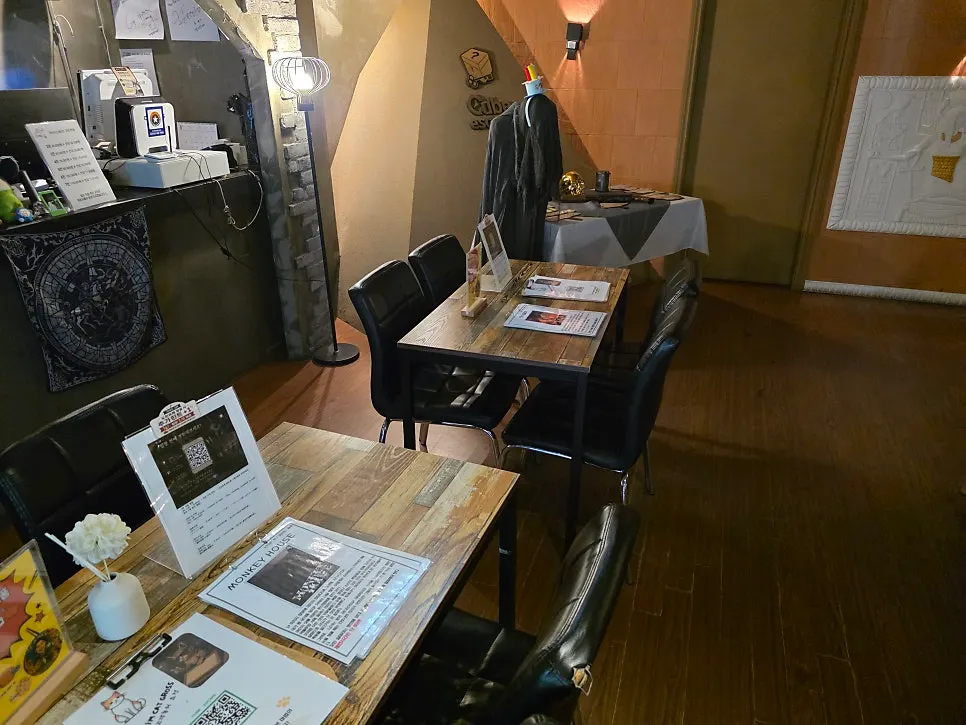 Store interior with tables for waiting before the escape room