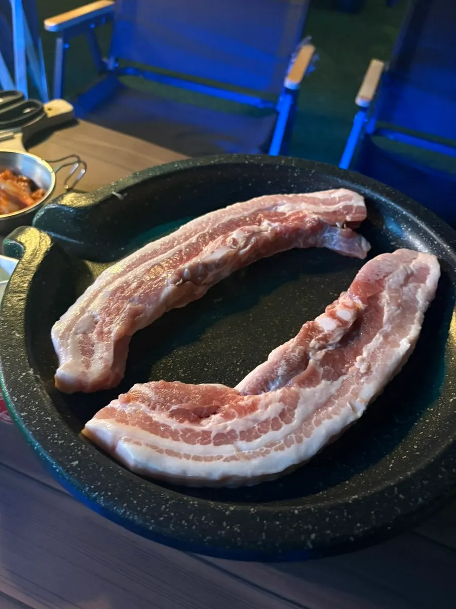 Fresh pork belly grilling on the pan