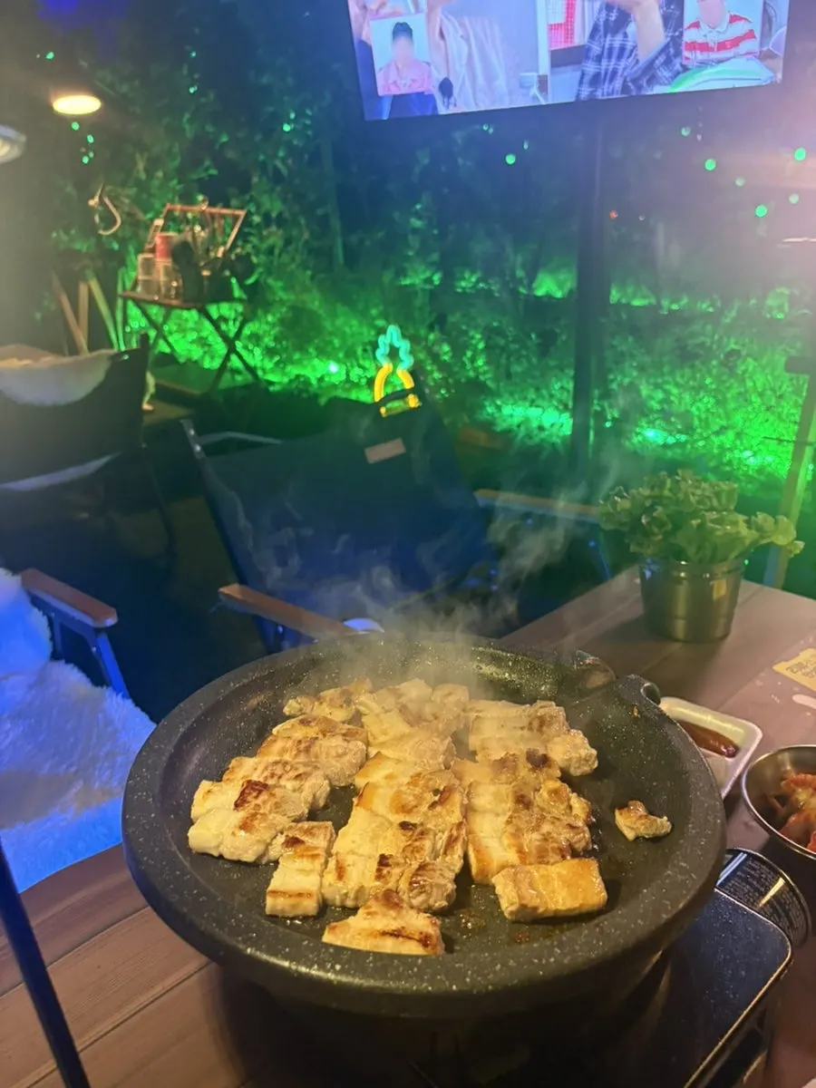 Kimchi grilling alongside the pork belly