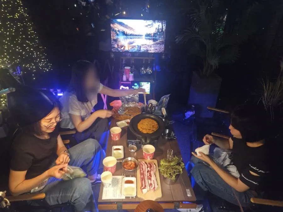 Private table being prepared for a camping-style meal
