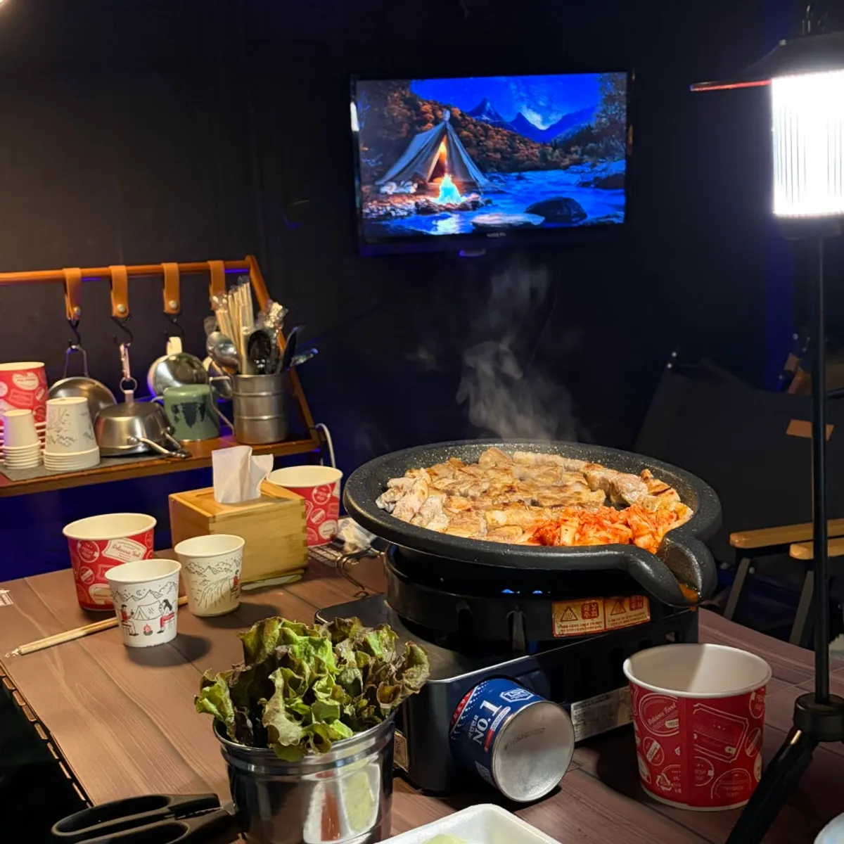 Grill table in the comfortable, well-ventilated indoor camping space