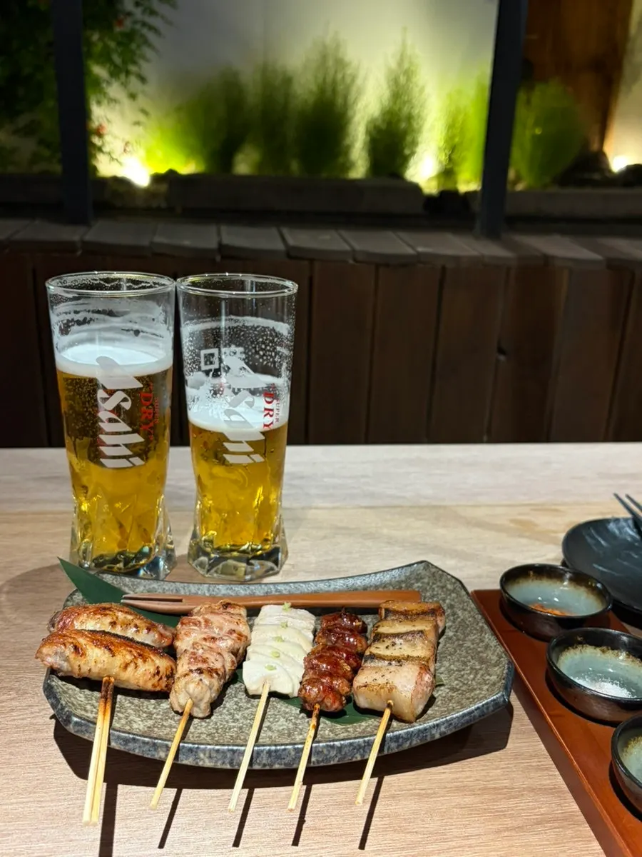 Scallion pesto, salt, and jjeuran served alongside the yakitori