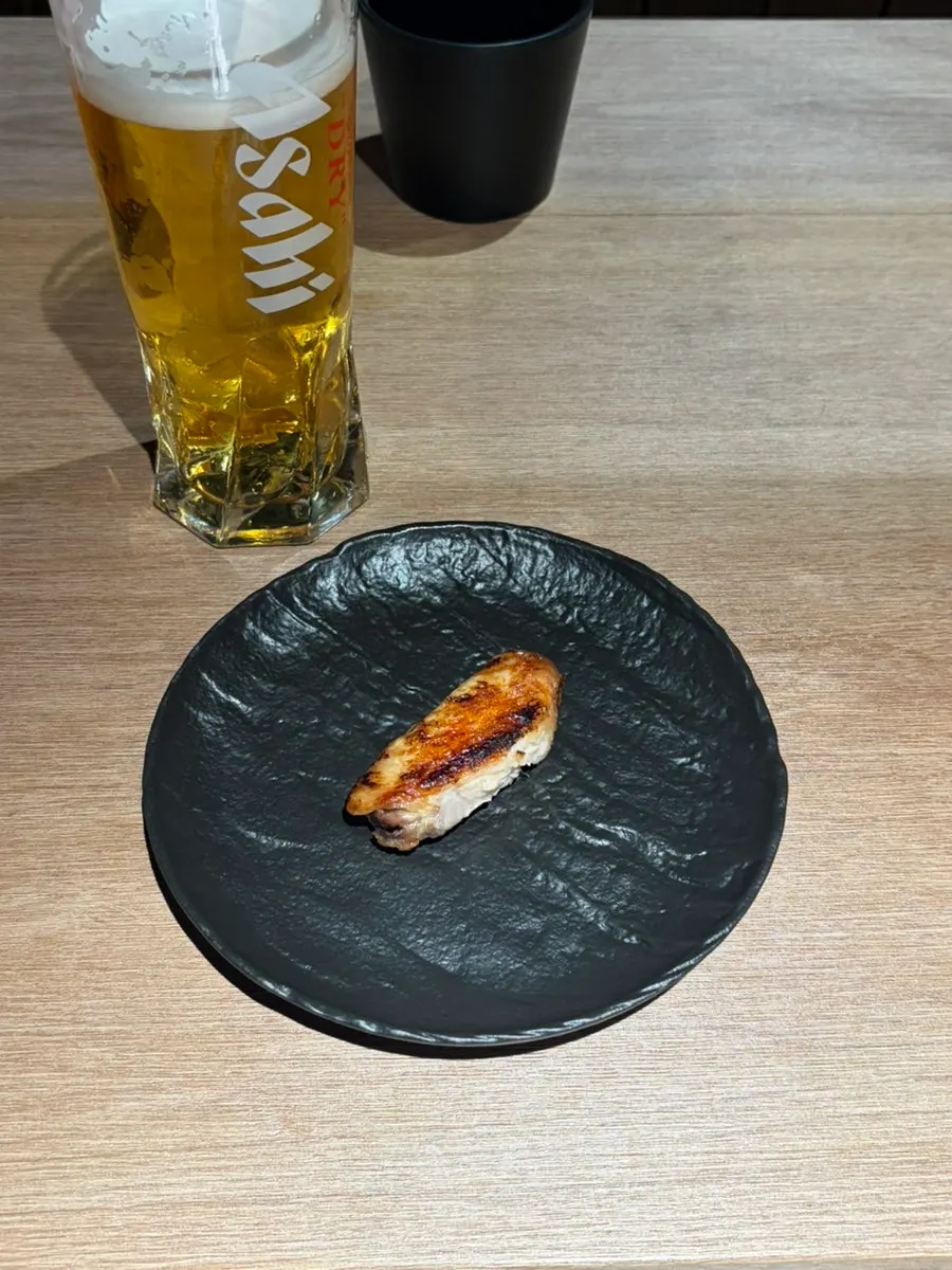 Chicken wing skewer brushed with tare sauce