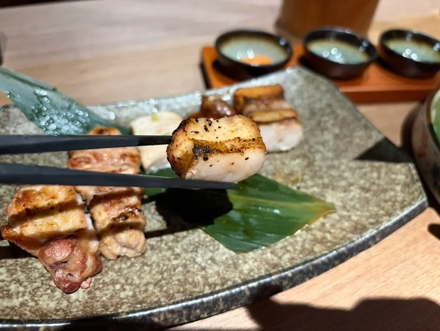 Pork jowl skewer with pale, tender flesh visible