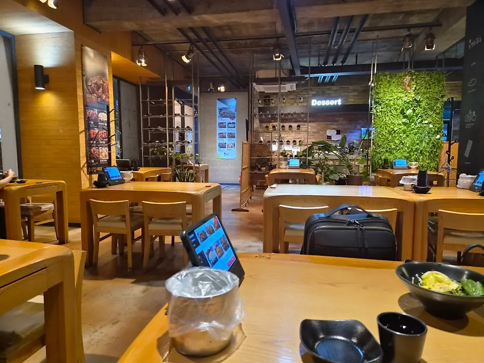 The spacious, clean wood-interior dining room of Ongdarae Jjimdak