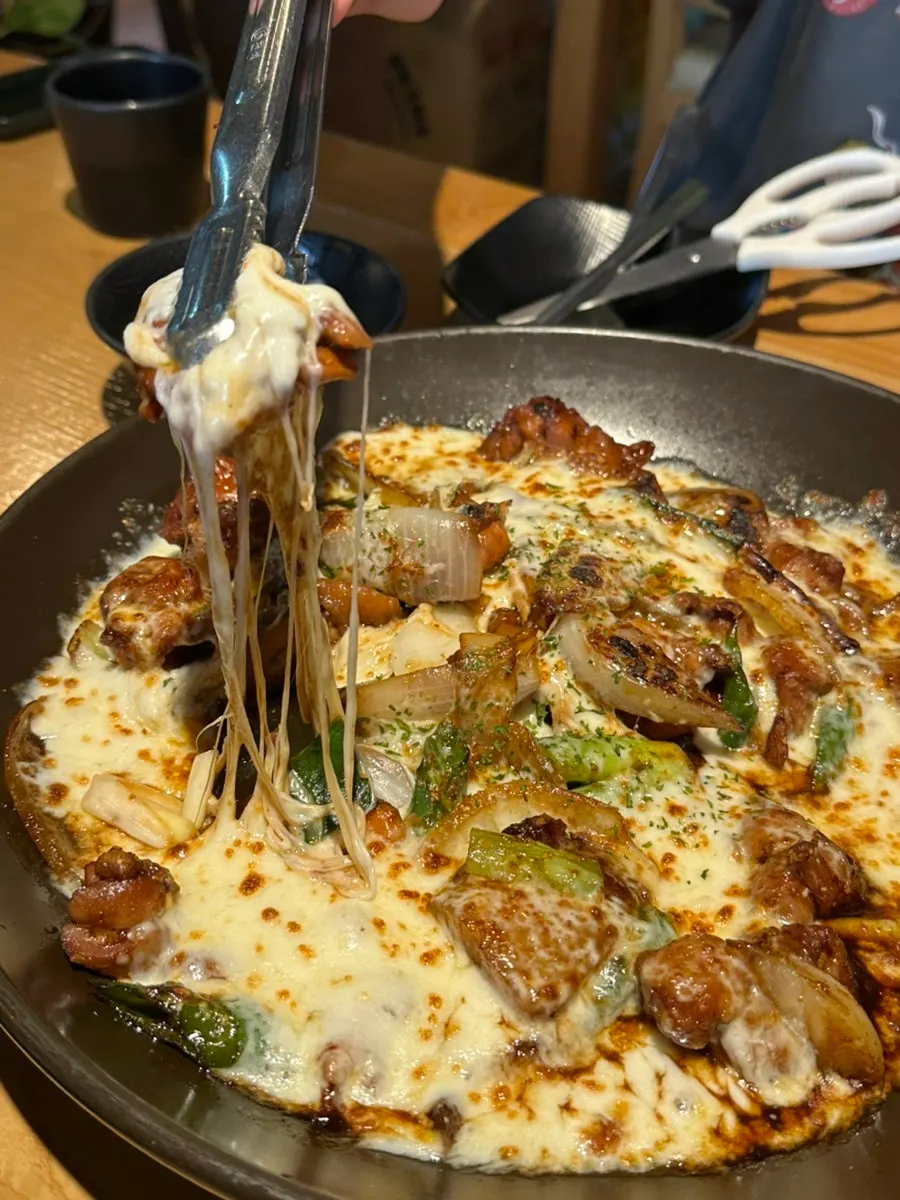 Cheese jjimdak with cheese overflowing the pot