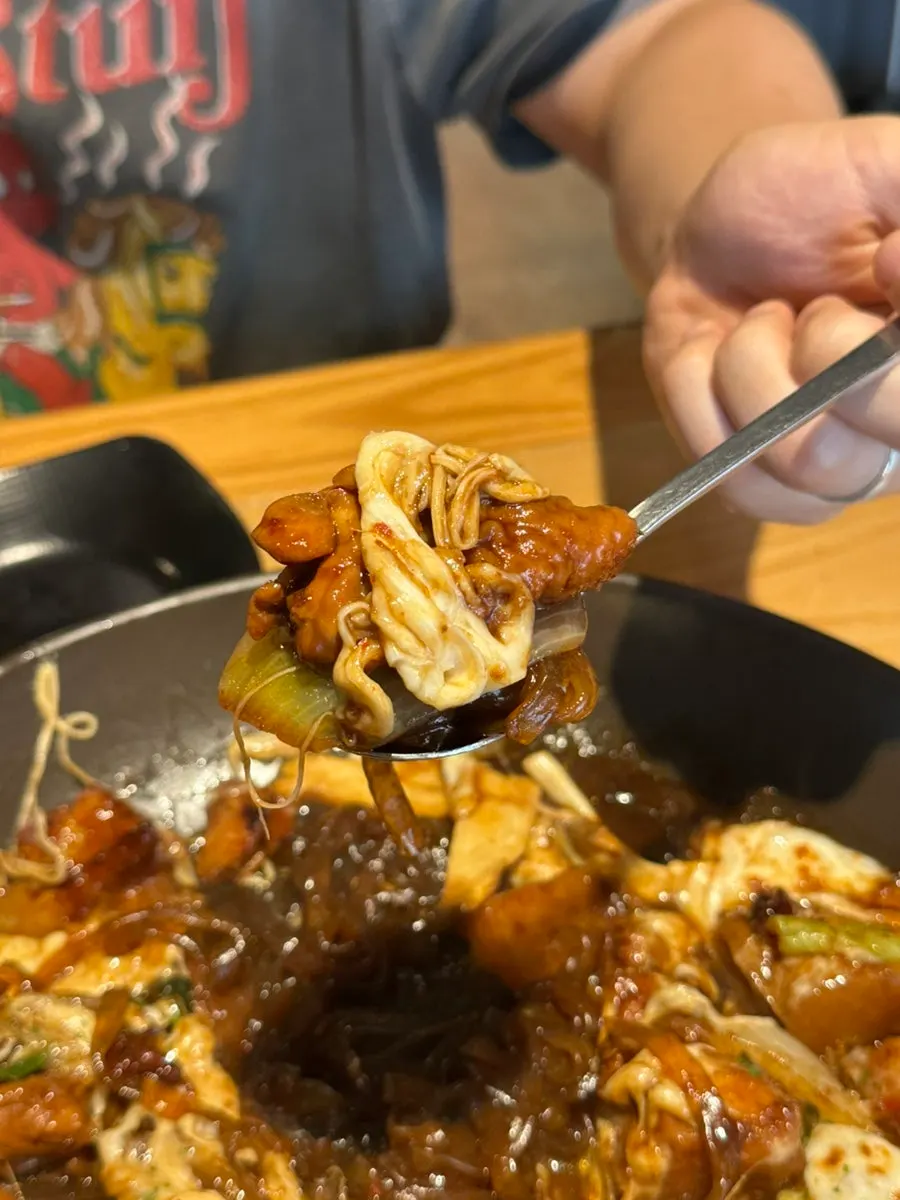 Close-up of sauce-soaked cheese jjimdak