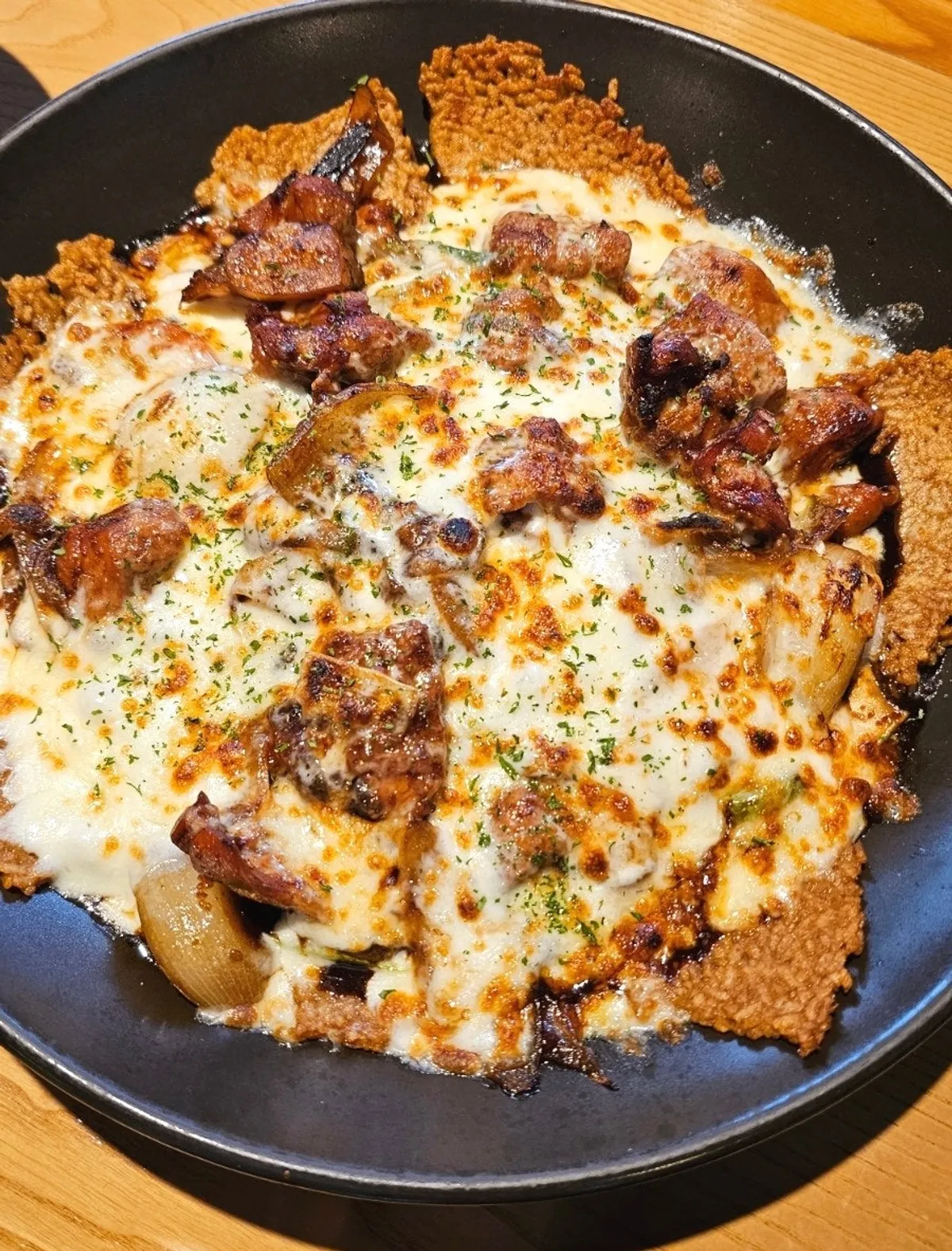 A full serving of boneless cheese jjimdak over crispy rice