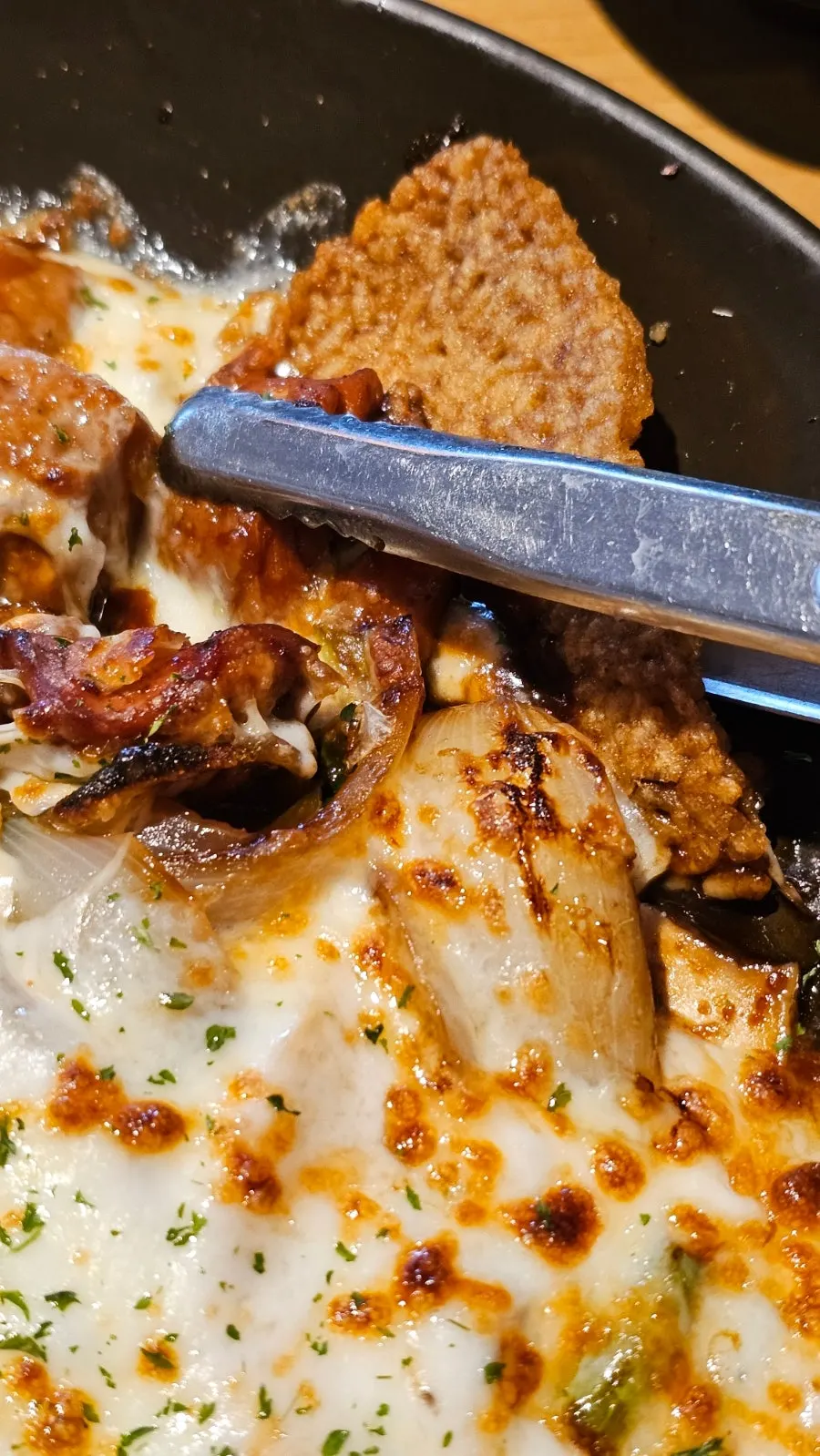 Close-up of jjimdak with potatoes and carrots