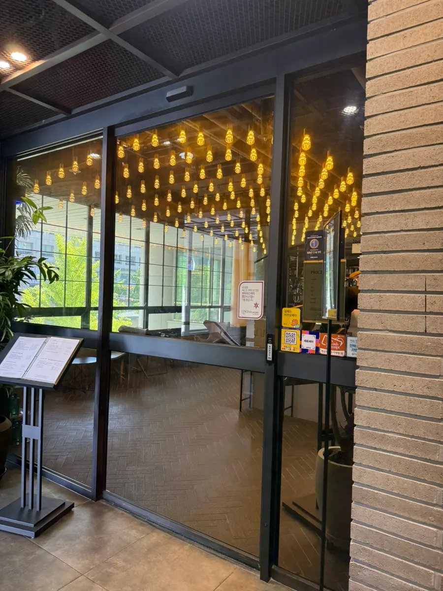 Entrance to Juno Hair on the 2nd floor of Magellan21 Officetel