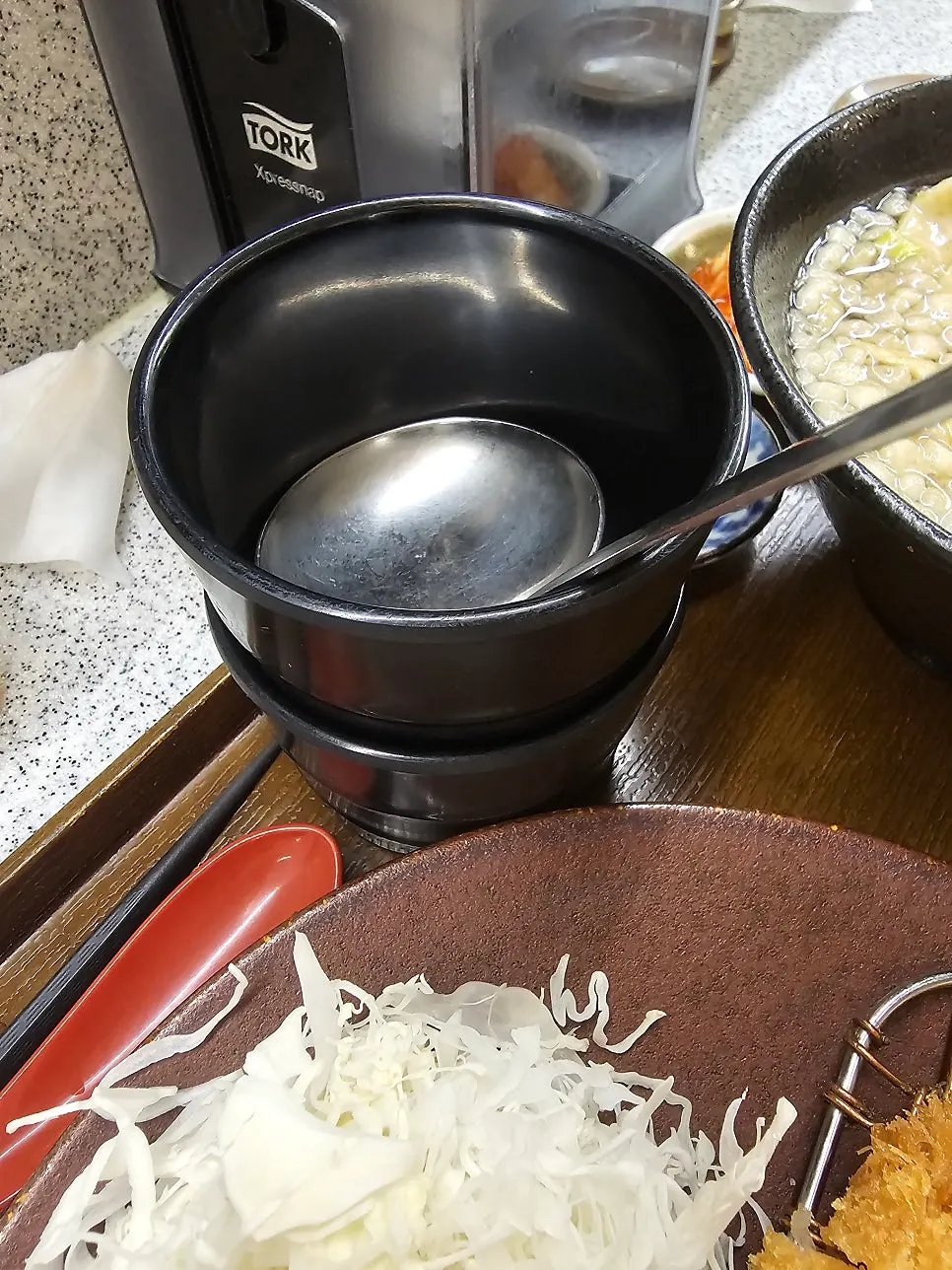 Spicy soup served beside rice