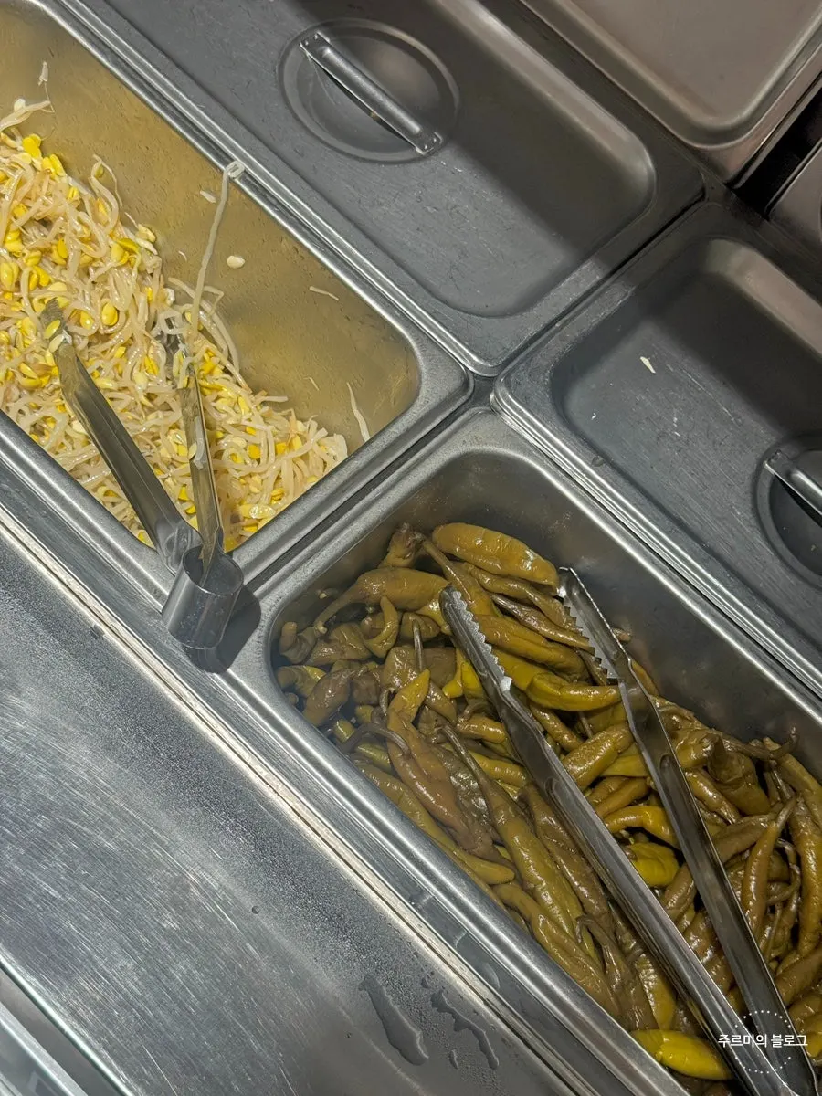 Sesame oil and side dish containers at the self-serve bar