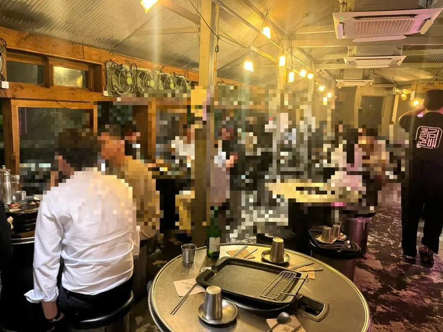 The restaurant packed with weekday evening customers