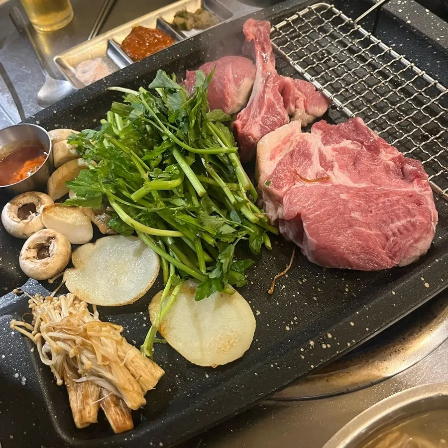 Pork set on the grill with minari