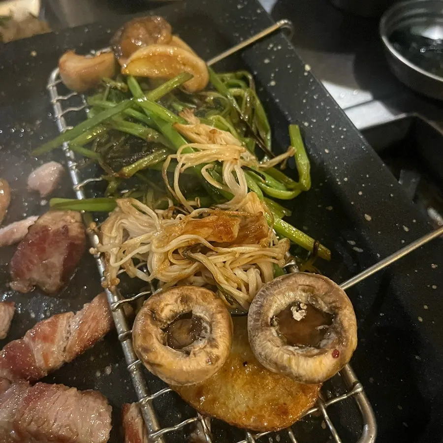 Minari grilled alongside the meat