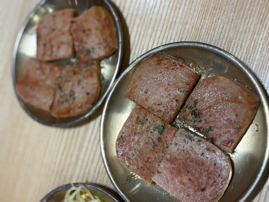 Seaweed flakes and sesame oil provided at each table
