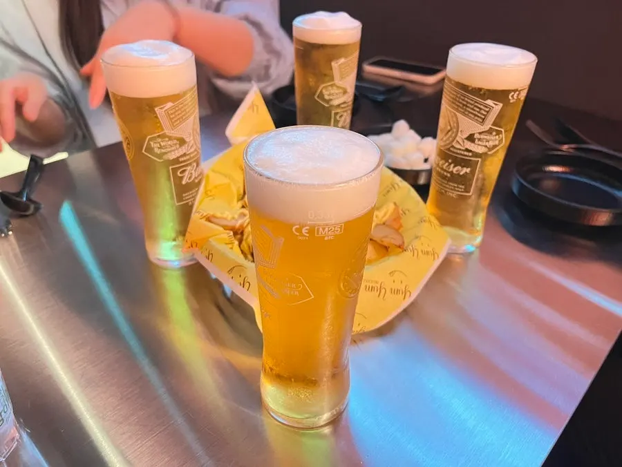 Two glasses of draft beer on the table