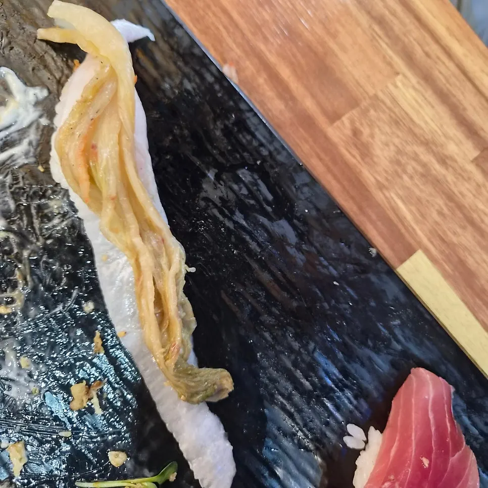 White fish sushi served with aged kimchi