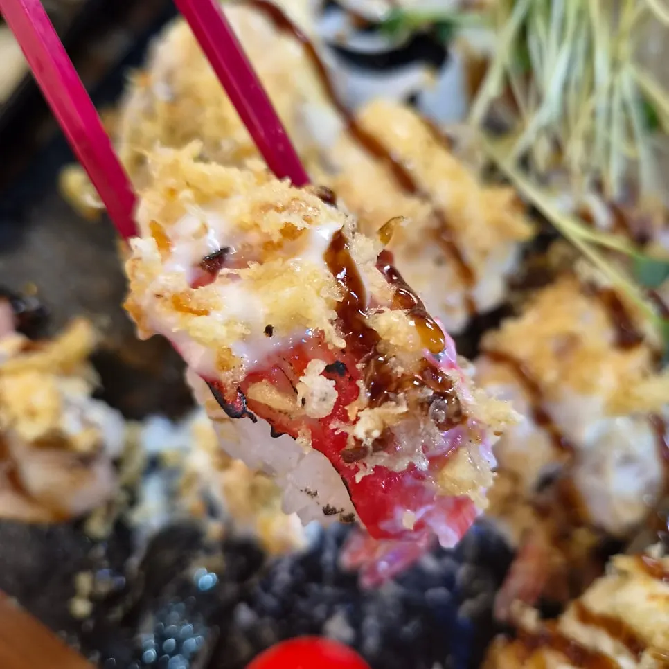 Roll topped with mayonnaise sauce and crispy fried crumbs