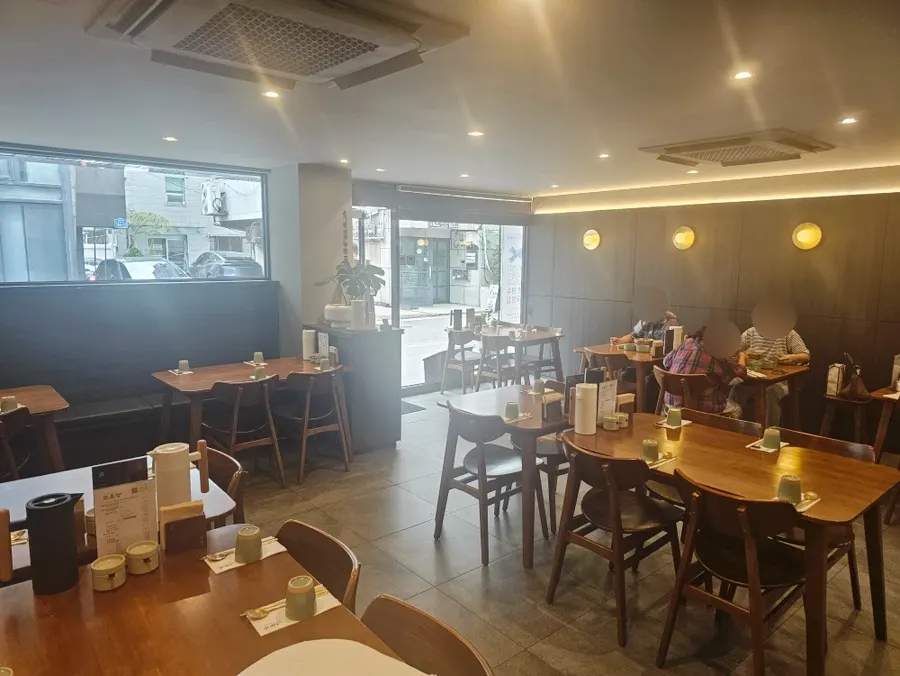 Neatly arranged hall seating at Doonjeong Hongdae Direct Branch