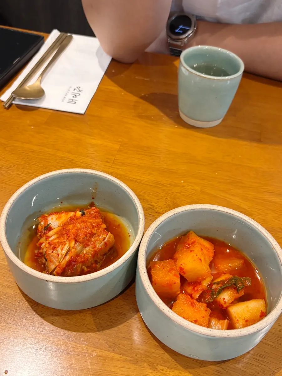 Two side dishes: napa cabbage kimchi and kkakdugi
