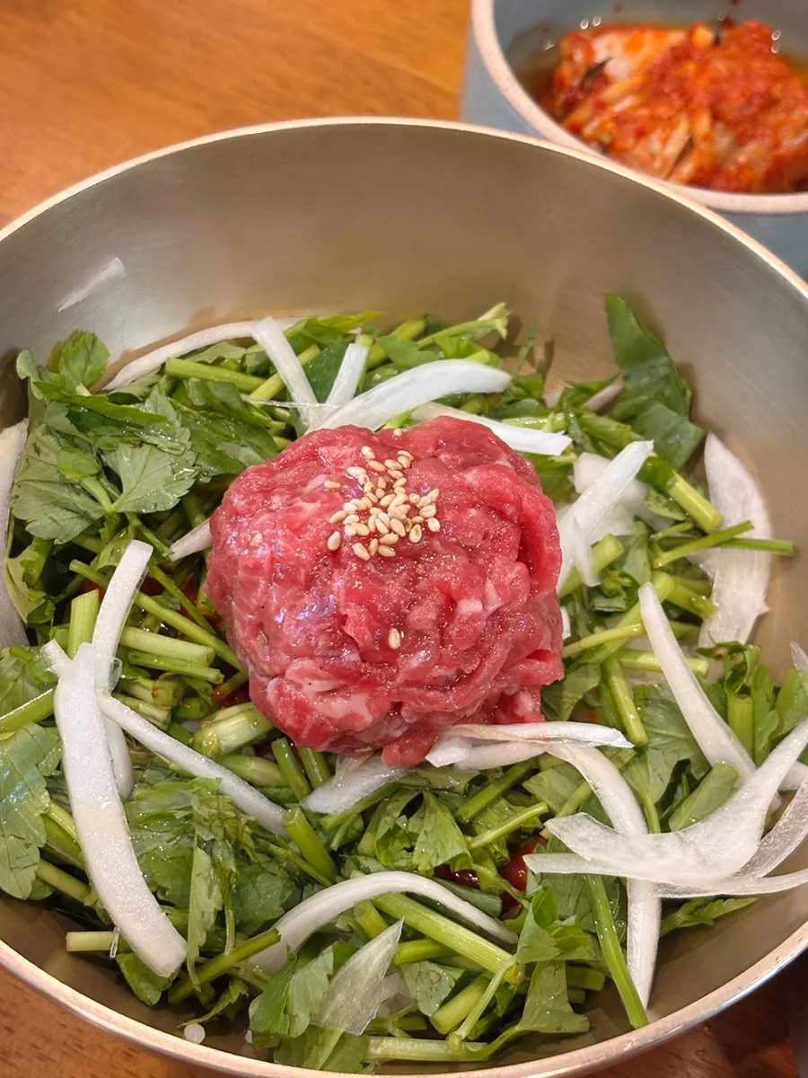 Doonjeong's hanwoo yukhoe bibimbap topped with minari