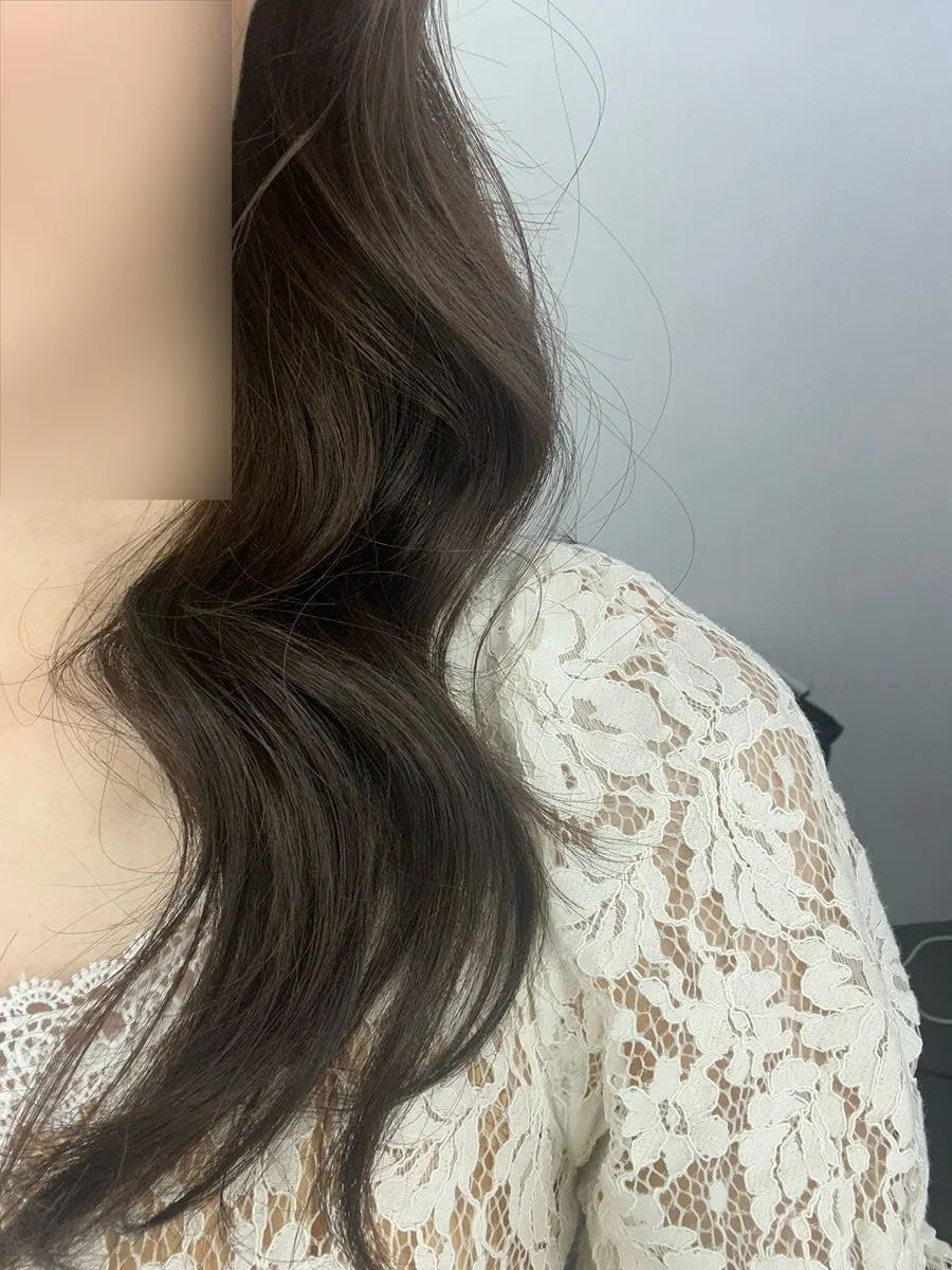Close-up of bold wavy hair with tidy baby hairs