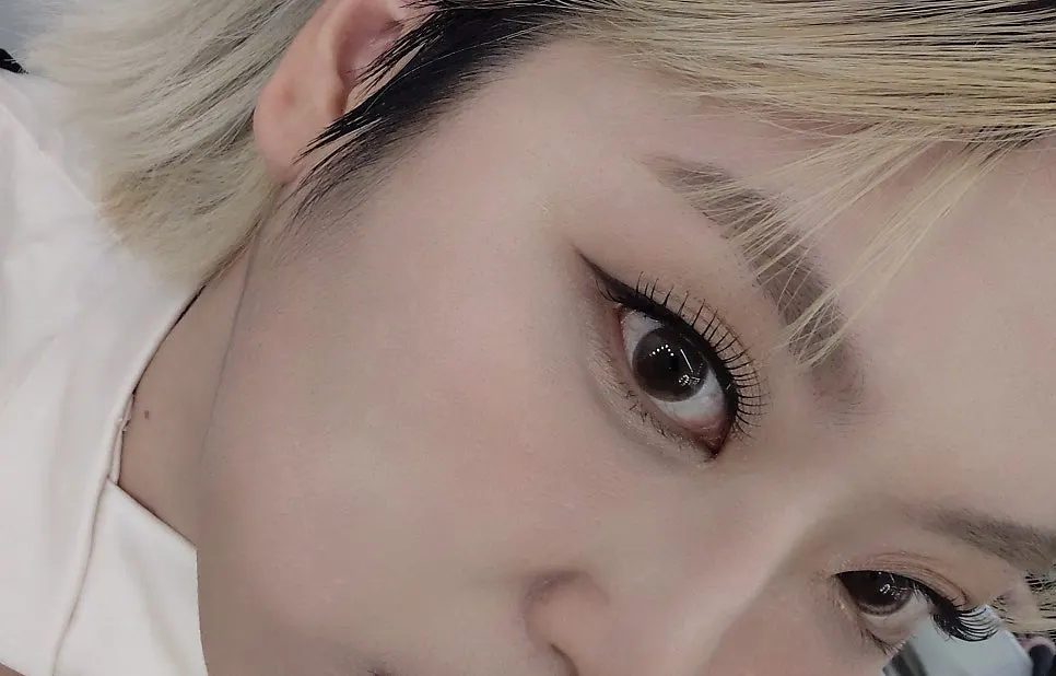 Close-up of dense lashes and shimmery eyeshadow
