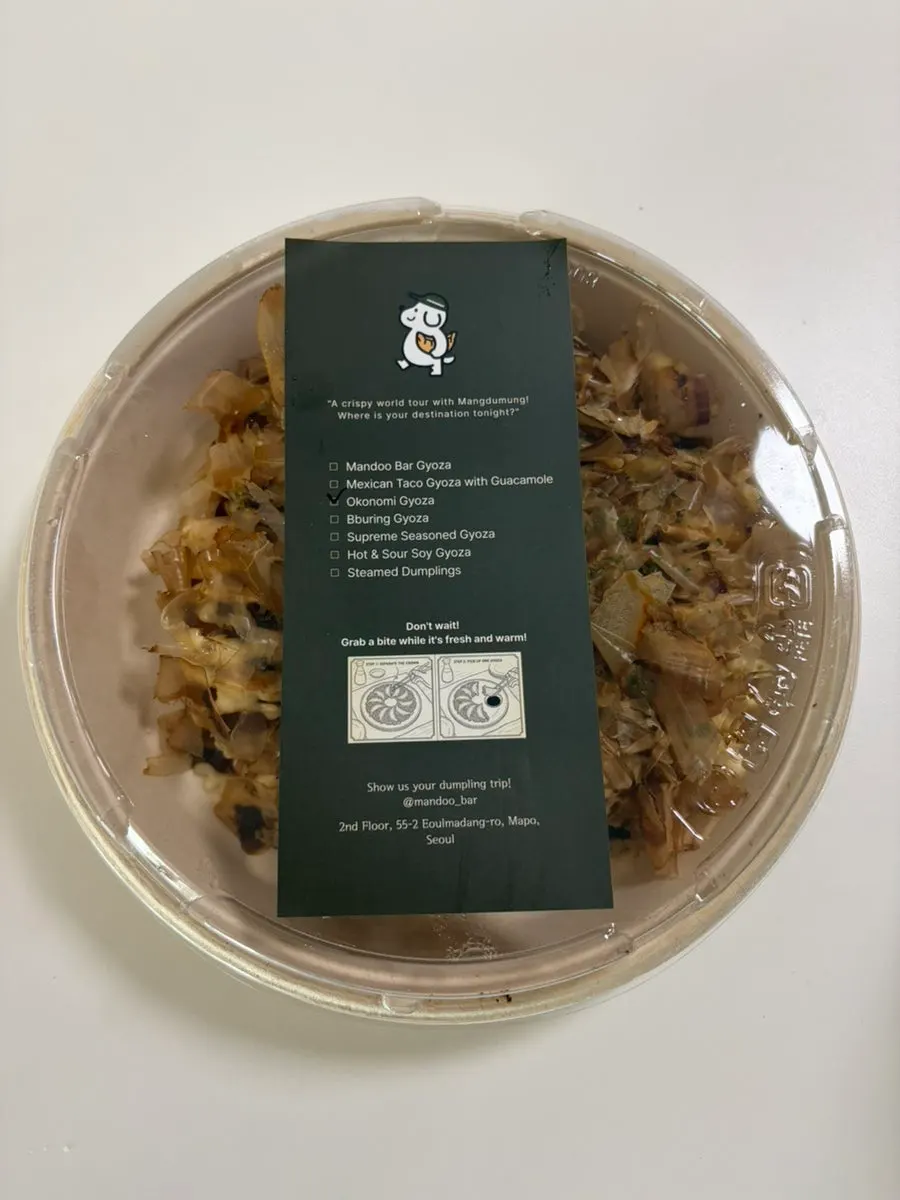 Takeout bag from the dumpling bar with printed instructions