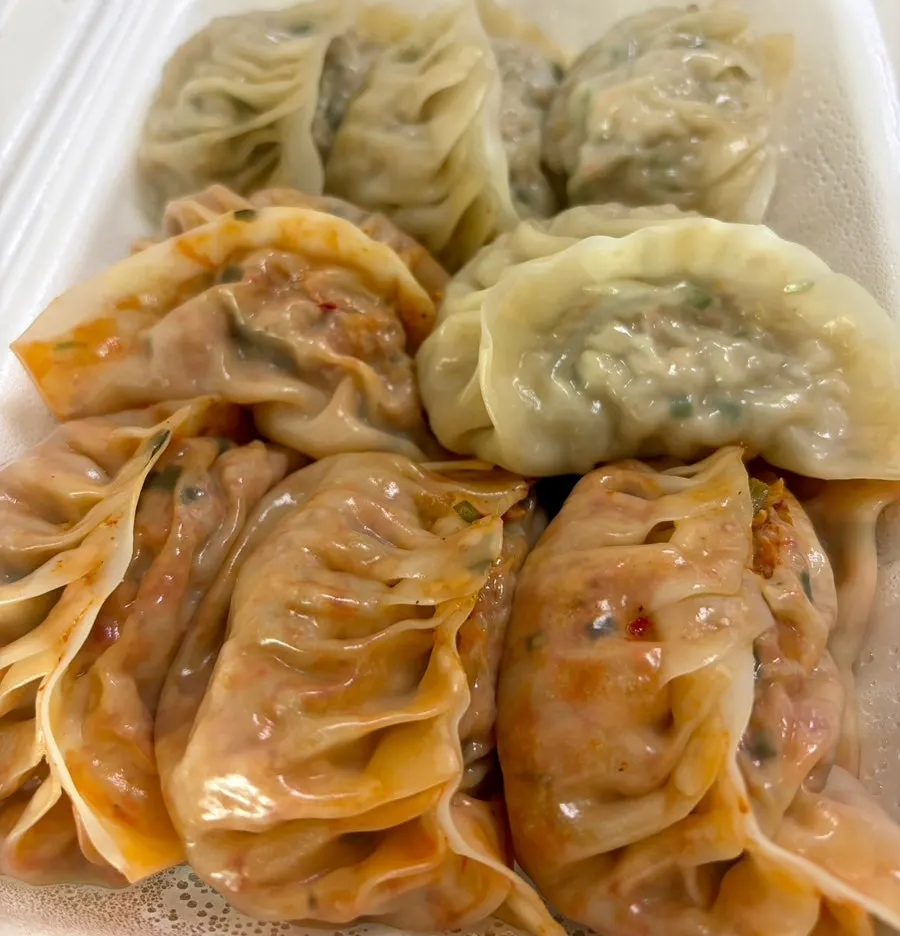 Okonomi gyoza piled high with bonito flakes