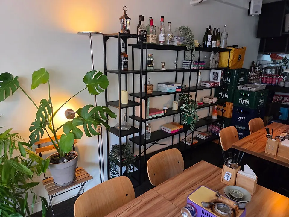Self-serve corner and signage on the 2nd floor of MANDOO BAR