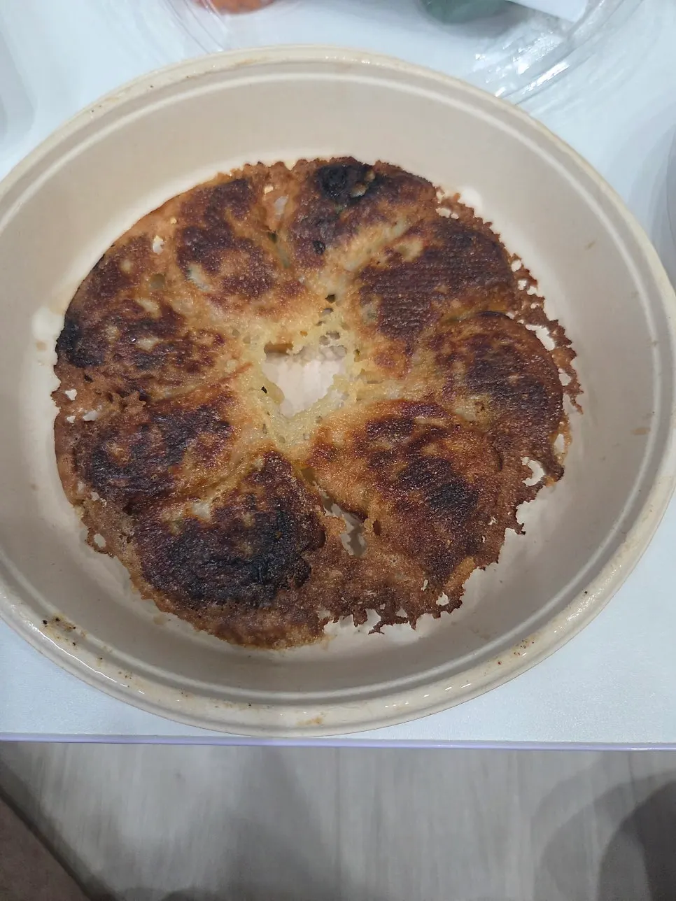 Gyoza and steamed dumplings set out on a home dining table