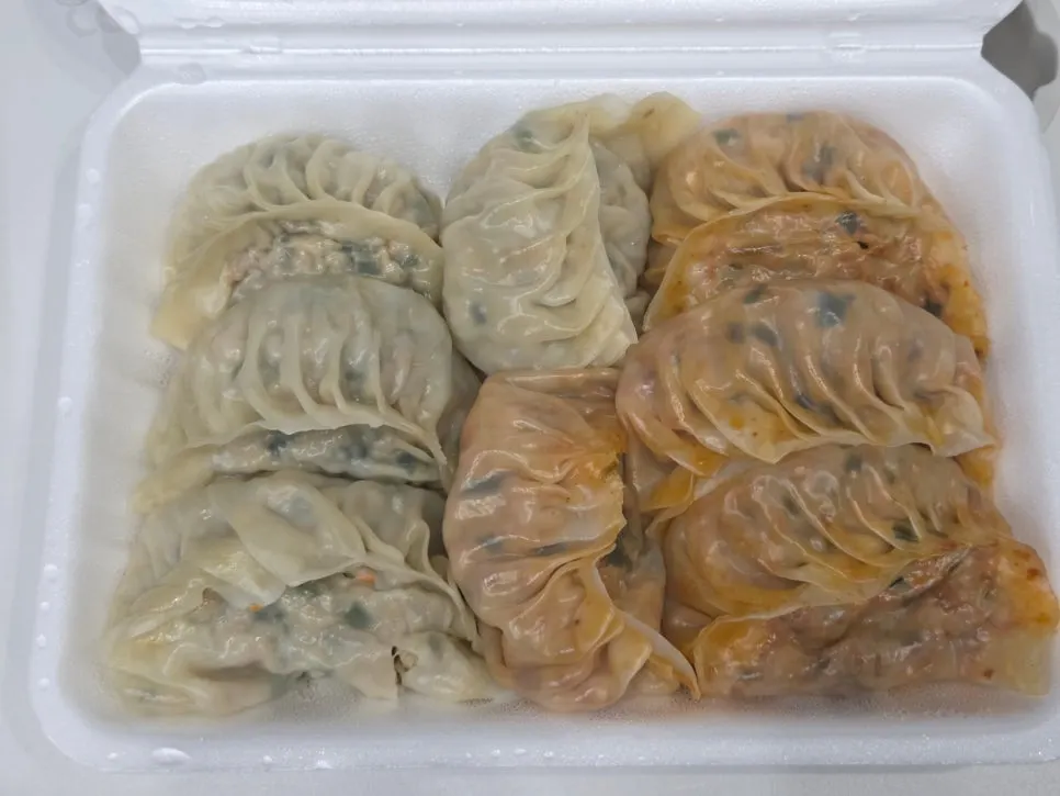 Okonomi gyoza piled high with bonito flakes
