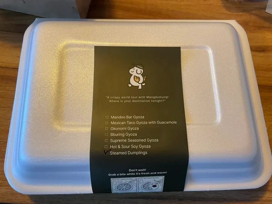 Sealed container of steamed dumplings
