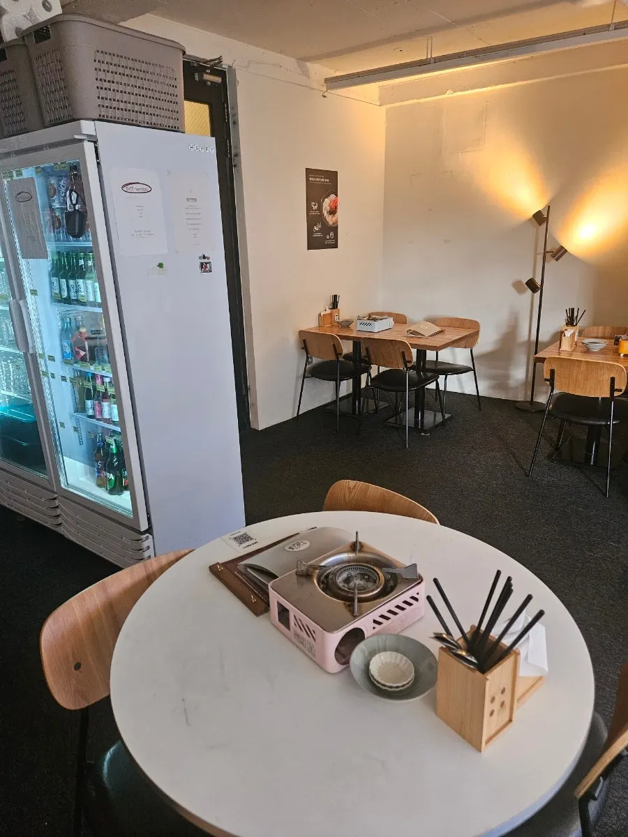 Interior of MANDOO BAR with a casual wine bar feel