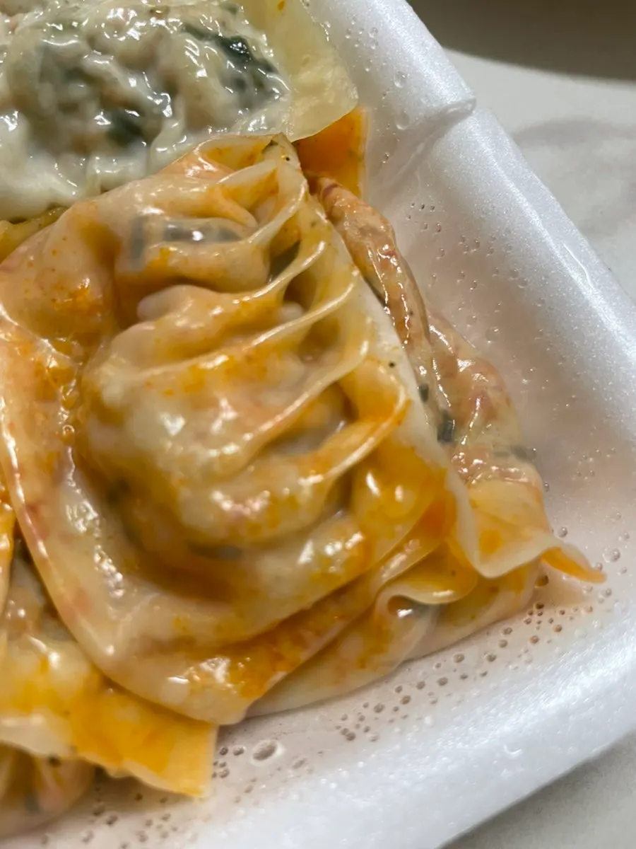 Eating a meat dumpling by hand
