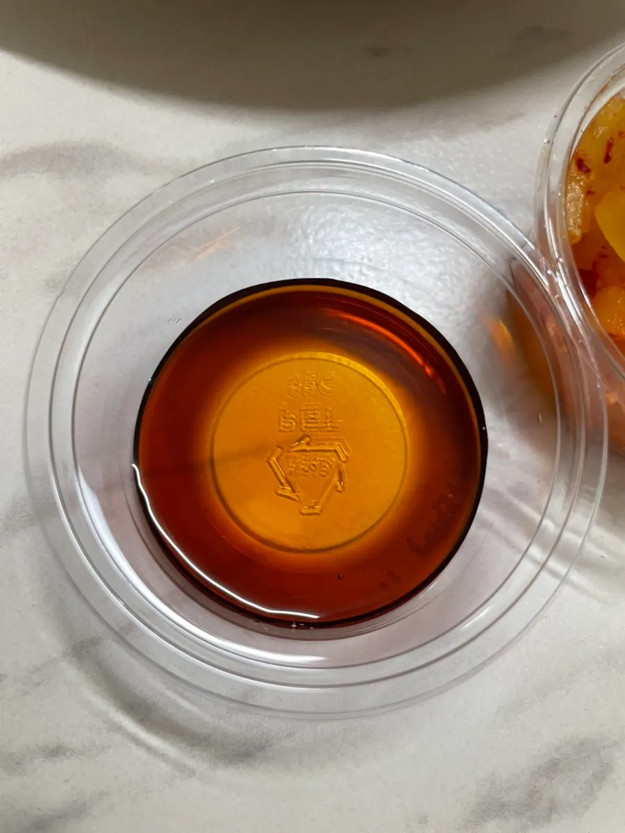 Pickled radish served alongside the dumplings