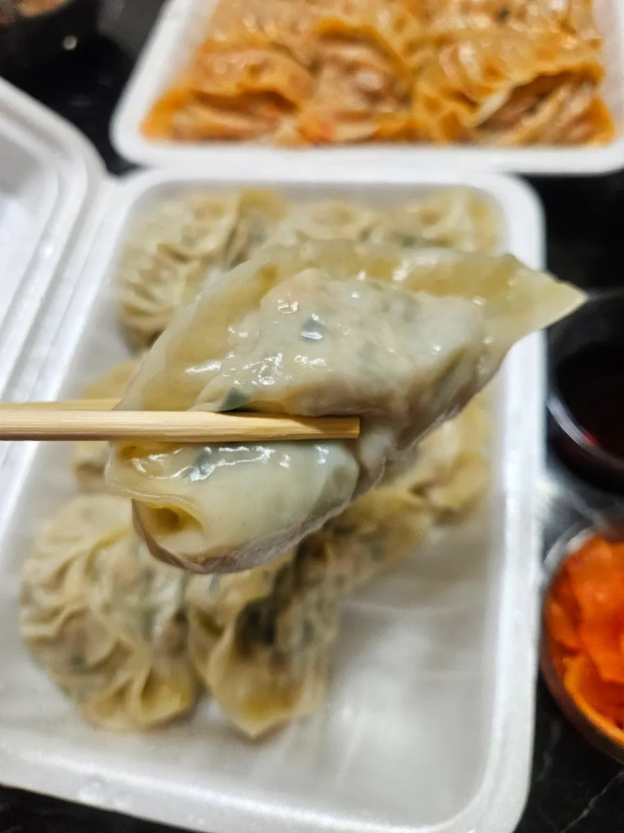 Yurinki gyoza drizzled with sauce