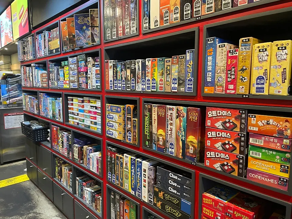 Bookcase displaying board games