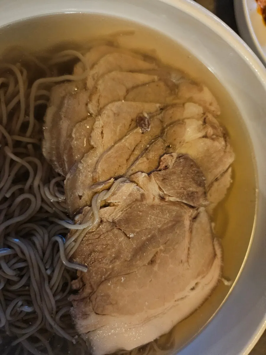A bowl of Pyongyang naengmyeon with plenty of meat