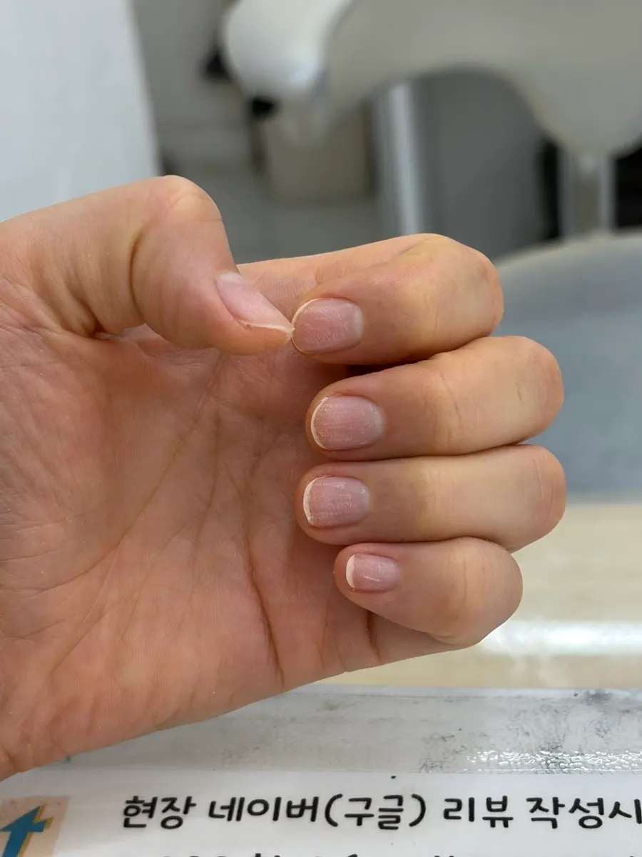 Nails shaped into a short, round square