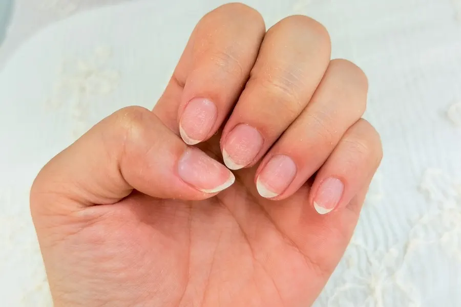 Hand receiving nail care