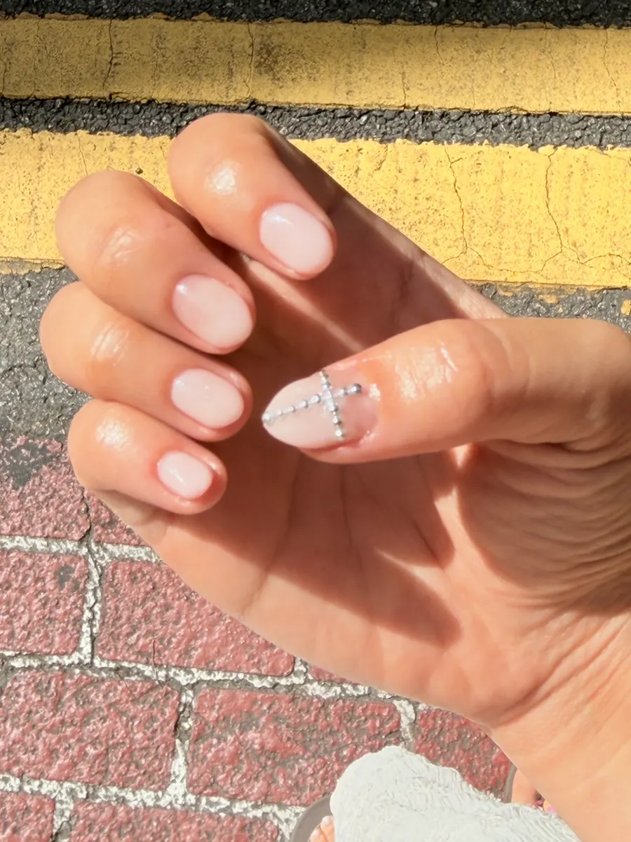 Finished nails in pink with cubic point details
