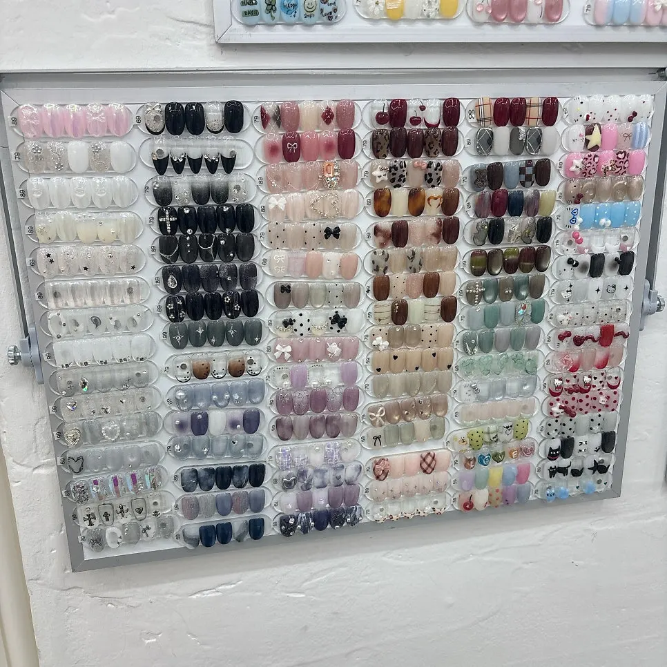 Various nail color tips arranged on display