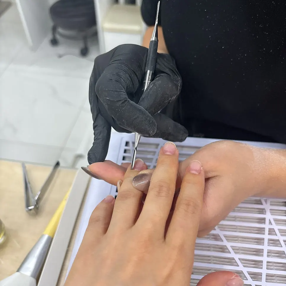 Close-up of nails during gel removal