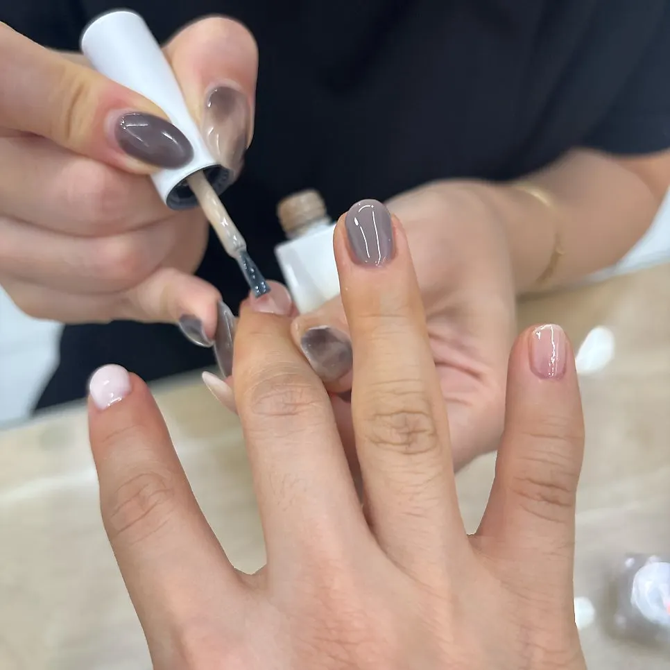 Finished nails with star and dot accent design