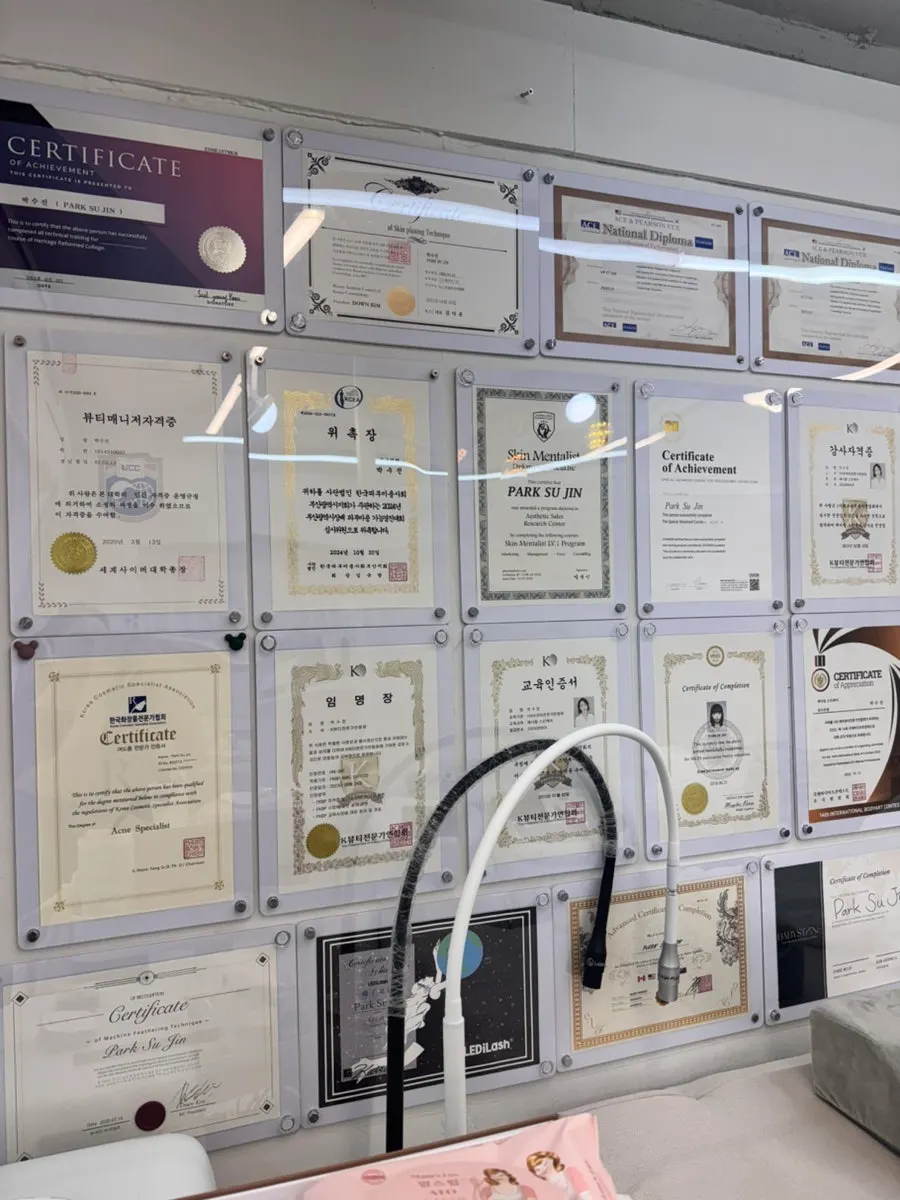 Appointment certificates and awards on the wall