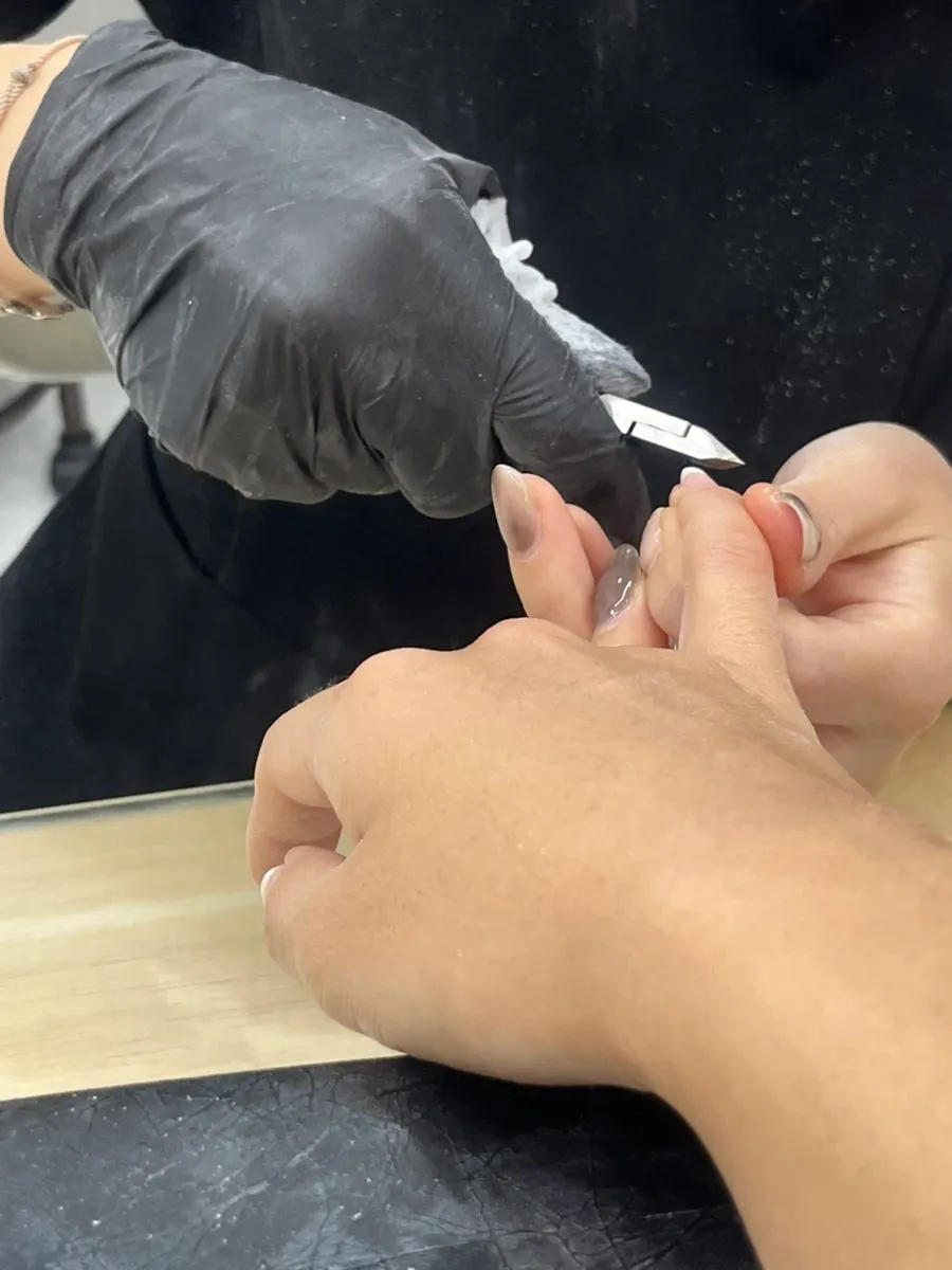 Nails before treatment, grown out long