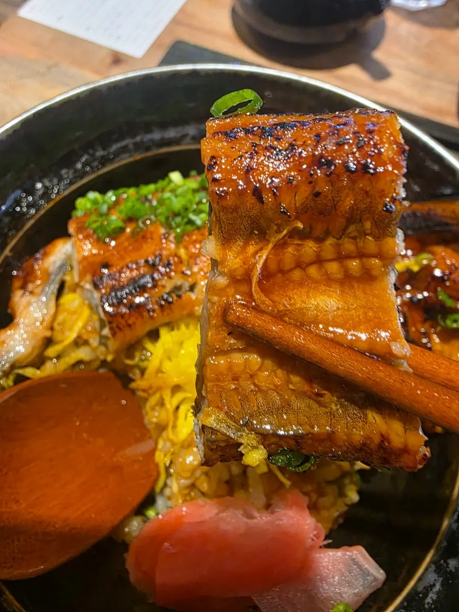 A bite taken out of the mushroom tempura