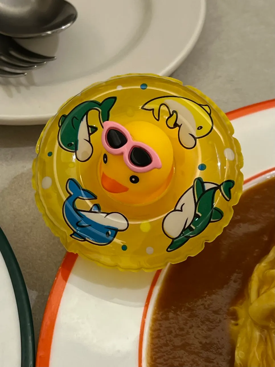 The rubber duck figure served alongside the omurice